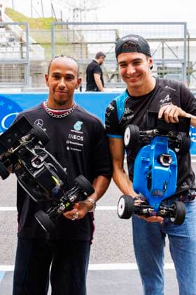21st September 2023; Suzuka Circuit, Suzuka, Japan; 2023 Formula 1 Lenovo Japanese Grand Prix; Arrival and Inspection Day; Lewis Hamilton and Esteban Ocon with replica toy cars  ActionPlus12555636 StephenxBlackberry
