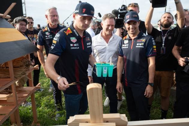 September 21, 2023, Suzuka, Mie Prefecture, Japan: MAX VERSTAPPEN (NED) of Red Bull Racing 1, CHRISTAIN HORNER and SERGIO PEREZ (MEX) of Red Bull Racing 11 painting a bee hotel...A Buzzin Corner bee hive bee hotel constructed as an initiative by former F1 World Champion Sebastian Vettel during Preparation Day of the Formula 1 Lenovo Japanese Grand Prix. Vettel called a meeting of all the 20 starting grid drivers at Turn 2 to personalize the bee hotels and draw media attention to environmental conservation efforts. Suzuka Japan - ZUMAb177 20230921_aap_b177_125 Copyright: xTaidghxBarronx