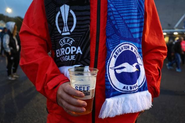 Brighton v AEK Athens 21 September 2023, Brighton - UEFA EUROPA League Football, Group Stage - Brighton & Hove Albion v AEK Athens - A fan with a EUROPA League Brighton scarf and a pint of beer - Photo: Charlotte Wilson Offside. Brighton UK Copyright: xCharlottexWilsonx xOffsidexOffside