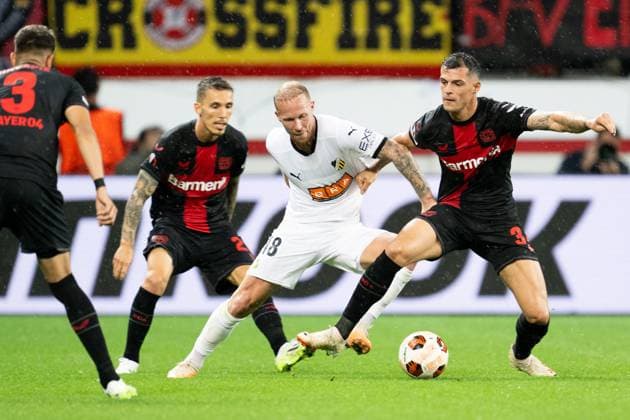 230921 Mikkel Rygaard Jensen of Häcken and Granit Xhaka of Bayer Leverkusen during the UEFA Europa League football match between Bayer Leverkusen and Häcken on September 21, 2023 in Leverkusen. Photo: Daniel Stiller BILDBYRAN kod DS DS0334 fotboll football soccer fotball uefa europa league bayer leverkusen häcken bbeng Copyright: DANIELxSTILLER BB230921DS027