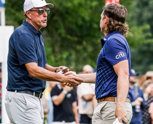 Phil Mickelson of the US (L) shakes hands with Cam Smith of Australia (R) after their first round of the 2023 LIV Golf League tournament at Rich Harvest Farms in Sugar Grove, Illinois, on Friday September 22, 2023. Tournament play runs from September 22nd through the 24th.  SGI20230922851 TANNENxMAURY