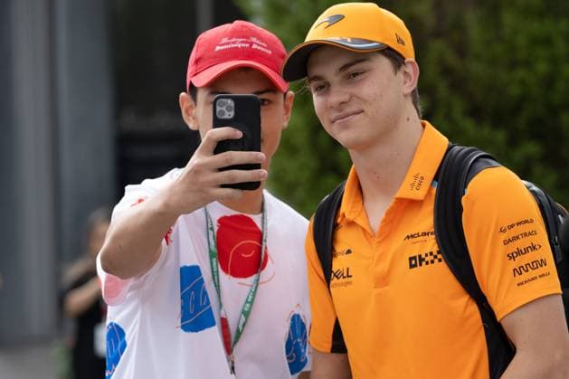 September 23, 2023, Suzuka, Mie Prefecture, Japan: OSCAR PIASTRI (AUS) of McLaren 81 takes a photo with a fan as he arrives to the paddock for Qualifying for the 2023 Formula 1 Japanese Grand Prix Suzuka Japan - ZUMAb177 20230923_aap_b177_011 Copyright: xTaidghxBarronx