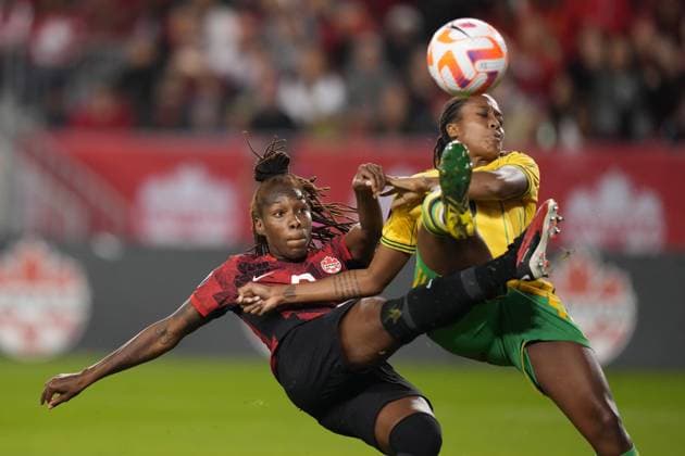 September 26, 2023, Toronto, ON, CANADA: Canada s Kadeisha Buchanan, left, moves the ball towards the Jamaican net as Paige Bailey defends during first half CONCACAF women s championship soccer series match in Toronto on Tuesday Sept. 26, 2023. Canada News - September 26, 2023  - ZUMAc35_ 20230926_zaf_c35_131 Copyright: xNathanxDenettex