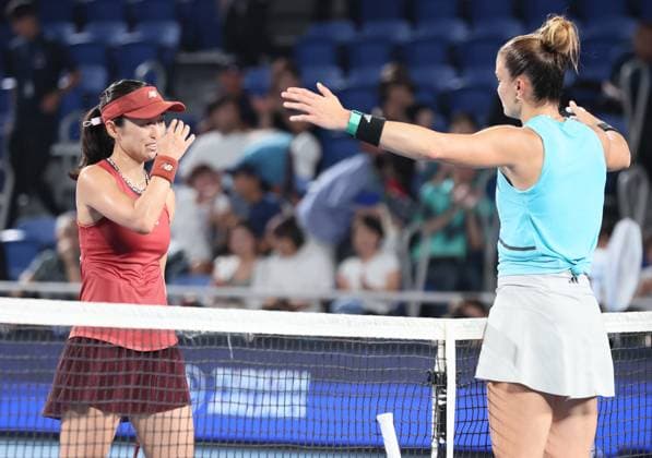 September 28, 2023, Tokyo, Japan - Misaki Doi of Japan (L) hugs with Maria Sakkari (R) of Greece after their game at the second round match of the Toray pan Pacific Open tennis tournament at the Ariake Colosseum in Tokyo on Thursday, September 28, 2023. Doi was defeated by Sakkari 3-6, 1-6 and withdrew from her professional carrier. (photo by Yoshio Tsunoda AFLO) Noxthirdxpartyxsales  (0306207805st)