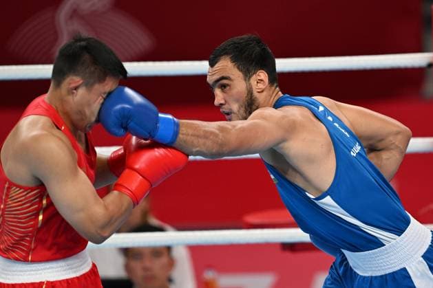 Sport Themen der Woche KW39 Sport Bilder des Tages (230929) -- HANGZHOU, Sept. 29, 2023 -- Lazizbek Mullojonov (R) of Uzbekistan competes during Boxing Men s 80-92kg Quarterfinal at the 19th Asian Games in Hangzhou, east China s Zhejiang Province, Sept. 29, 2023. ) (SP)CHINA-HANGZHOU-ASIAN GAMES-BOXING (CN) ZhanxYan 