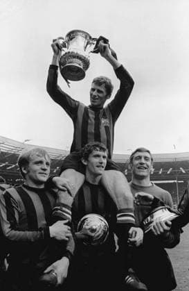 Tony Book - Man City Captain holds aloft the FA Cup trophy. Below : left to right , Francis Lee,Mike Doyle,Harry Dowd (goalkeeper). 1969 FA Cup Final, Manchester City v Leicester City. Wembley. 