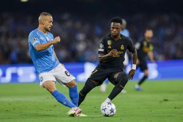 Italy: Serie a football match SSC Napoli vs Real Madrid SSC Napoli s Slovak midfielder Stanislav Lobotka challenges for the ball with Real Madrid s Brazilian forward Vinicius Junior during the Uefa champions league match between SSC Napoli vs Real Madrid at the Diego Armando Maradona Stadium in Naples, southern Italy, on October 03, 2023. ABPH1509_1 Copyright: xAntonioxBalascox