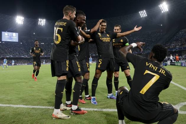 Jude Bellingham of Real Madrid CF celebrates with team mates after scoring the goal of 1-2 during the Champions League Group C football match between SSC Napoli and Real Madrid FC at Diego Armando Maradona stadium in Naples (Italy), October 3rd, 2023. cesarexpurini