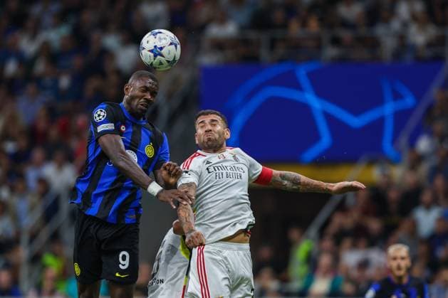 Marcus Thuram of FC Internazionale seen in action with Nicolas Otamendi of SL Benfica during the UEFA Champions League 2023 24 Group Stage - Group D football match between FC Internazionale and SL Benfica at Giuseppe Meazza Stadium, Milan, Italy on October 03, 2023  Copyright: xFabrizioxCarabelli IPAxSportx xix xx IPA_40751991 IPA_IPA40751991