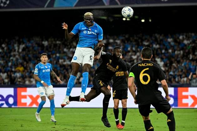 Victor Osimhen of SSC Napoli headers as he is challenged by Antonio Rudiger of Real Madrid CF during the Champions League Group C football match between SSC Napoli and Real Madrid FC at Diego Armando Maradona stadium in Naples (Italy), October 3rd, 2023. AndreaxStaccioli