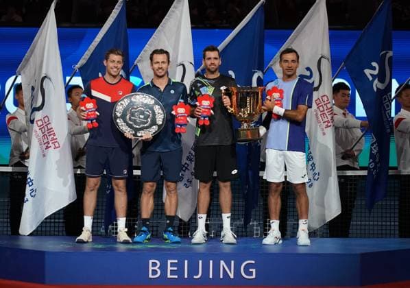 (231004) -- BEIJING, Oct. 4, 2023 -- Wesley Koolhof (2nd L) of Netherlands, Neal Skupski of Britain (1st L), Ivan Dodig (1st R) of Croatia, and Austin Krajicek of U.S. attend awarding ceremony for the men s doubles final at 2023 China Open tennis tournament in Beijing, capital of China, Oct. 4, 2023. ) (SP)CHINA-BEIJING-TENNIS-CHINA OPEN-MEN S DOUBLES-FINAL (CN) ZhangxChenlin 