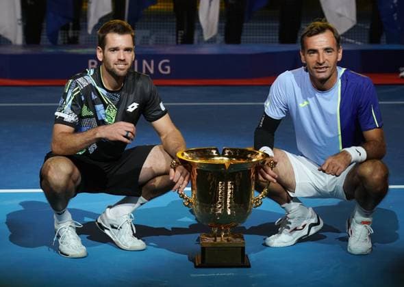 (231004) -- BEIJING, Oct. 4, 2023 -- Ivan Dodig (R) of Croatia and Austin Krajicek of U.S. attend awarding ceremony for the men s doubles at 2023 China Open tennis tournament in Beijing, capital of China, Oct. 4, 2023. ) (SP)CHINA-BEIJING-TENNIS-CHINA OPEN-MEN S DOUBLES-FINAL (CN) ZhangxChenlin 