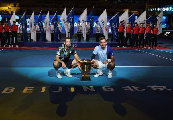 (231004) -- BEIJING, Oct. 4, 2023 -- Ivan Dodig (R) of Croatia and Austin Krajicek of U.S. attend awarding ceremony for the men s doubles at 2023 China Open tennis tournament in Beijing, capital of China, Oct. 4, 2023. ) (SP)CHINA-BEIJING-TENNIS-CHINA OPEN-MEN S DOUBLES-FINAL (CN) ZhangxChenlin 