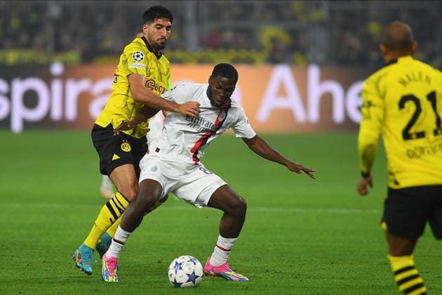 DORTMUND, GERMANY - 04.10.23: Emre Can, Yunus Musah, The match of match UEFA Champion League Borussia Dortmund vs AC Milan at SIGNAL IDUNA PARK  Copyright: xVITALIIxKLIUIEVx
