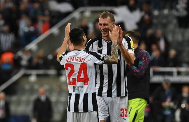 Dan Burn of Newcastle United and Miguel Almiron of Newcastle United at full time during the UEFA Champions League match between Newcastle United and Paris Saint Germain at St. James s Park, Newcastle, England on 4 October 2023. Copyright: xAndyxRowlandx PMI-5817-0054