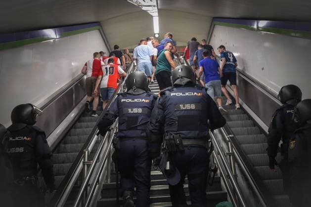 October 4, 2023, Madrid, Spain: Feyenoord fans are escorted by the Spanish national police on the metro on the way to the Metropolitan stadium in Madrid. Nearly 4,000 ultras from Feyenoord Rotterdam have traveled to Madrid to cheer on the Dutch team that faced Atletico de Madrid in the first phase of the UEFA Champions League at the metropolitan stadium and in which the Spanish club won by 3 -2. At all times the Dutch were escorted by the Spanish national police. Nearly 4,000 ultras from Feyenoord Rotterdam have traveled to Madrid to cheer on the Dutch team that faced Atletico de Madrid in the first phase of the UEFA Champions League at the metropolitan stadium which the Spanish club won by 3 -2. At all times the Dutch were escorted by the Spanish national police. Madrid Spain - ZUMAs197 20231004_aaa_s197_168 Copyright: xDavidxCanalesx
