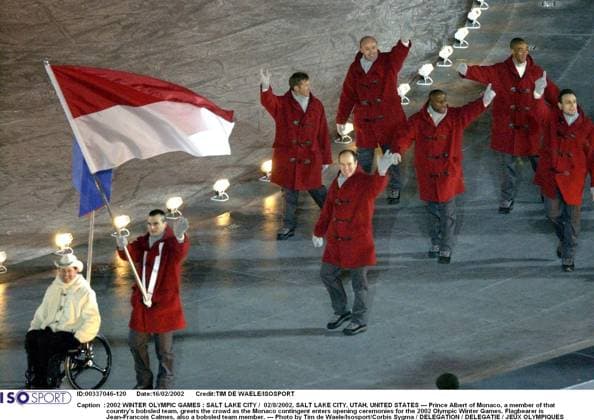 2002 WINTER Olympic Games, Olympische Spiele, Olympia, OS : 2002 WINTER OLYMPIC GAMES : SALT LAKE CITY 02 8 2002, SALT LAKE CITY, UTAH, UNITED STATES --- Prince Albert of Monaco, a member of that country s bobsled team, greets the crowd as the Monaco contingent enters opening ceremonies for the 2002 Olympic Winter games, Winterspiele,Spiele, Summer games Flagbearer is Jean-Francois Calmes, also a bobsled team member. --- Photo by Tim de Waele Isosport Corbis Sygma DELEGATION DELEGATIE JEUX OLYMPIQUES D HIVER OLYMPISCHE SPELEN www.iso be Ogden United States ETATS UNIS VERENIGDE STATEN  Copyright: xTIMxDExWAELEx 55827