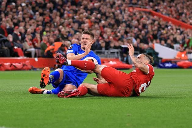 Football - UEFA Europa League - Group E - Liverpool v Union Saint-Gilloise 5th October 2023 - UEFA Europa League - Group E - Liverpool v Union Saint-Gilloise - Alessio Castro-Montes of Union Saint-Gilloise is tackled by Kostas Tsimikas of Liverpool - Photo: Simon Stacpoole Offside. Liverpool UK Copyright: xSimonxStacpoolexOffside