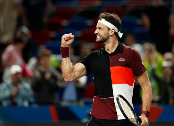 (231011) -- SHANGHAI, Oct. 11, 2023 -- Grigor Dimitrov of Bulgaria celebrates after winning the men s singles round of 16 match between Carlos Alcaraz of Spain and Grigor Dimitrov of Bulgaria at the ATP, Tennis Herren Shanghai Masters tennis tournament in Shanghai, east China, Oct. 11, 2023. ) (SP)CHINA-SHANGHAI-TENNIS-ATP TOUR-SHANGHAI MASTERS(CN) WangxLili 