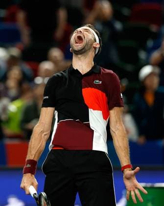 (231011) -- SHANGHAI, Oct. 11, 2023 -- Grigor Dimitrov of Bulgaria jubilates after winning the men s singles round of 16 match between Carlos Alcaraz of Spain and Grigor Dimitrov of Bulgaria at the ATP, Tennis Herren Shanghai Masters tennis tournament in Shanghai, east China, Oct. 11, 2023. ) (SP)CHINA-SHANGHAI-TENNIS-ATP TOUR-SHANGHAI MASTERS(CN) WangxLili 