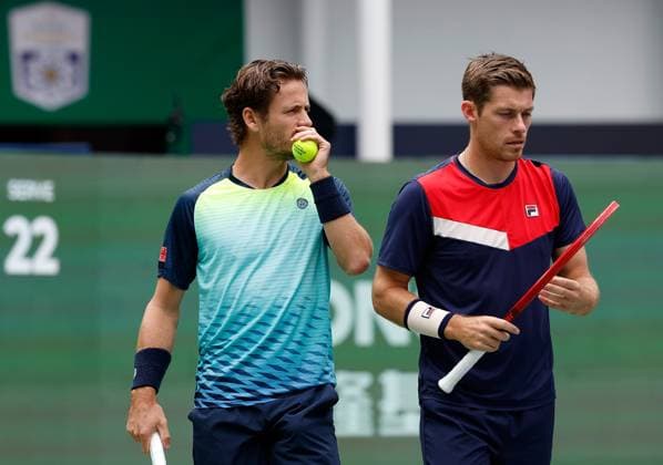 (231012) -- SHANGHAI, Oct. 12, 2023 -- Wesley Koolhof of the Netherlands Neal Skupski (R) of Britain react during the men s doubles quaterfinal between Sadio Doumbia Fabien Reboul of France and Wesley Koolhof of the Netherlands Neal Skupski of Britain at the ATP, Tennis Herren World Tour Shanghai Masters tennis tournament at Qizhong Forest Sports City Arena in Shanghai, east China, Oct. 12, 2023. ) (SP)CHINA-SHANGHAI-TENNIS-ATP TOUR-SHANGHAI MASTERS(CN) WangxLili 