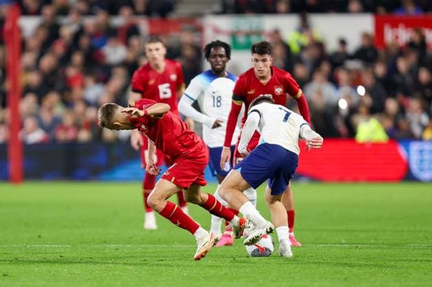 Serbia s Vladimir Lucic is dispossessed by England s James McAtee during the UEFA U-21 EURO 2025 Qualifier match between England U-21 and Serbia U-21 at the City Ground, Nottingham, England on 12 October 2023. Copyright: xStuartxLeggettx 38630032