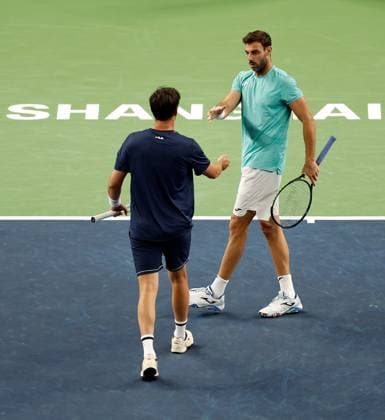 (231013) -- SHANGHAI, Oct. 13, 2023 -- Marcel Granollers (R) of Spain Horacio Zeballos of Argentina react during the men s doubles semifinal between Marcel Granollers of Spain Horacio Zeballos of Argentina and Rinky Hijikata of Australia Cameron Norrie of Britain at the ATP, Tennis Herren World Tour Shanghai Masters tennis tournament at Qizhong Forest Sports City Arena in Shanghai, east China, Oct. 13, 2023. ) (SP)CHINA-SHANGHAI-TENNIS-ATP TOUR-SHANGHAI MASTERS(CN) WangxLili 