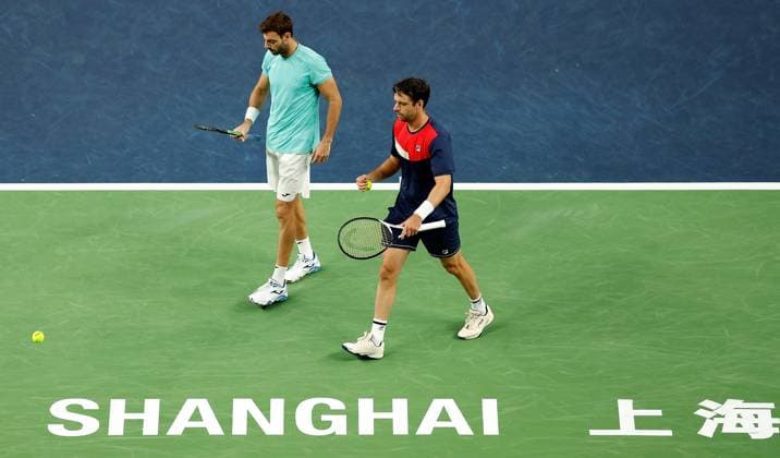 (231013) -- SHANGHAI, Oct. 13, 2023 -- Marcel Granollers (L) of Spain Horacio Zeballos of Argentina react during the men s doubles semifinal between Marcel Granollers of Spain Horacio Zeballos of Argentina and Rinky Hijikata of Australia Cameron Norrie of Britain at the ATP, Tennis Herren World Tour Shanghai Masters tennis tournament at Qizhong Forest Sports City Arena in Shanghai, east China, Oct. 13, 2023. ) (SP)CHINA-SHANGHAI-TENNIS-ATP TOUR-SHANGHAI MASTERS(CN) WangxLili 