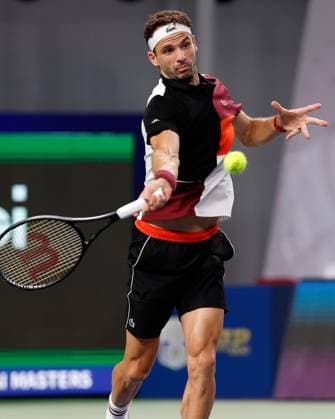 (231013) -- SHANGHAI, Oct. 13, 2023 -- Grigor Dimitrov of Bulgaria returns the ball during the men s singles quaterfinal against Nicolas Jarry of Chile at the ATP, Tennis Herren World Tour Shanghai Masters tennis tournament at Qizhong Forest Sports City Arena in Shanghai, east China, Oct. 13, 2023. ) (SP)CHINA-SHANGHAI-TENNIS-ATP TOUR-SHANGHAI MASTERS(CN) WangxLili 