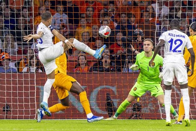 AMSTERDAM, 13-10-2023 JohanCruyff Arena, Football Euro2024 Qualifier between Netherlands and France. France player Kylian Mbappe (L) scores 1-0 with Netherlands goalkeeper Bart Verbruggen (R) during the game Netherlands - France. Netherlands - France  x22733342x Copyright: