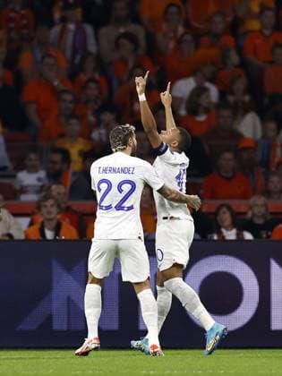 AMSTERDAM - (l-r) Theo Hernandez of France, Kylian Mbappe of France celebrate the 0-1 during the European Championship, EM, Europameisterschaft Qualifying match in group B between the Netherlands and France at the Johan Cruijff ArenA on October 13, 2023 in Amsterdam, the Netherlands. ANP MAURICE VAN STEEN UEFA EURO, EM, Europameisterschaft,Fussball 2024 Qualifying Round 2023 2024 xVIxANPxSportx xxANPxIVx 480998585 originalFilename: 480998585.jpg