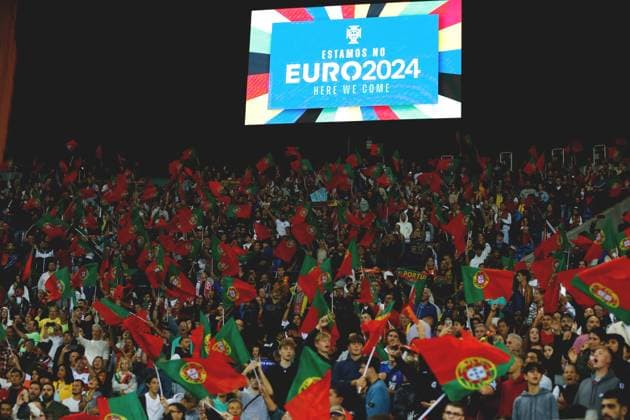 Portugal fans, OCTOBER 13, 2023 - Football Soccer : Portugal fans celebrate to have decided to participate in next year s European Championship, EM, Europameisterschaft and an electronic bulletin board announces their participation after winning UEFA EURO, EM, Europameisterschaft,Fussball 2024 Qualifying round Group J match between Portugal 3-2 Slovakia at the Estadio do Dragao in Porto, Portugal. Noxthirdxpartyxsales  (232478910)