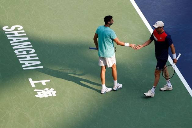 (231015) -- SHANGHAI, Oct. 15, 2023 -- Marcel Granollers of Spain Horacio Zeballos (R) of Argentina react during the men s doubles final between Marcel Granollers of Spain Horacio Zeballos of Argentina and Rohan Bopanna of India Matthew Ebden of Australia at the ATP, Tennis Herren World Tour Shanghai Masters tennis tournament at Qizhong Forest Sports City Arena in Shanghai, east China, Oct. 15, 2023. ) (SP)CHINA-SHANGHAI-TENNIS-ATP TOUR-SHANGHAI MASTERS(CN) WangxLili 