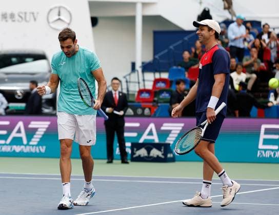 (231015) -- SHANGHAI, Oct. 15, 2023 -- Marcel Granollers (L) of Spain Horacio Zeballos of Argentina celebrate after winning the men s doubles final between Marcel Granollers of Spain Horacio Zeballos of Argentina and Rohan Bopanna of India Matthew Ebden of Australia at the ATP, Tennis Herren World Tour Shanghai Masters tennis tournament at Qizhong Forest Sports City Arena in Shanghai, east China, Oct. 15, 2023. ) (SP)CHINA-SHANGHAI-TENNIS-ATP TOUR-SHANGHAI MASTERS(CN) WangxLili 