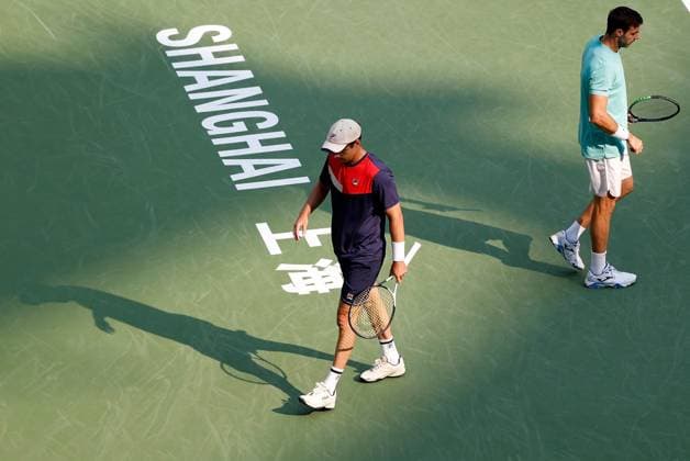 (231015) -- SHANGHAI, Oct. 15, 2023 -- Marcel Granollers of Spain Horacio Zeballos (L) of Argentina react during the men s doubles final between Marcel Granollers of Spain Horacio Zeballos of Argentina and Rohan Bopanna of India Matthew Ebden of Australia at the ATP, Tennis Herren World Tour Shanghai Masters tennis tournament at Qizhong Forest Sports City Arena in Shanghai, east China, Oct. 15, 2023. ) (SP)CHINA-SHANGHAI-TENNIS-ATP TOUR-SHANGHAI MASTERS(CN) WangxLili 