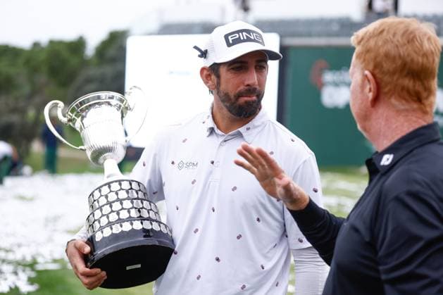 October 15, 2023, MADRID, MADRID, SPAIN: Matthieu Pavon of France talks to his coach, Jamie Gough, with the trophy after winning the Acciona Open de Espana, Round 4, Golf tournament celebrated at Club de Campo on October 15, 2023, in Madrid, Spain. MADRID SPAIN - ZUMAa181 20231015_zaa_a181_239 Copyright: xOscarxJ.xBarrosox