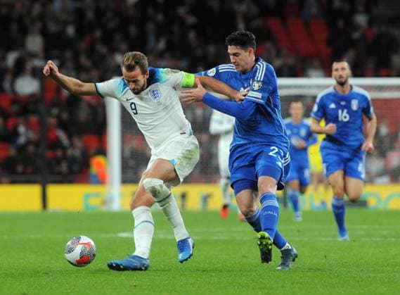 Football - 2024 UEFA European Championships - Qualifying - Group C - England vs Italy - Wembley Stadium - Tuesday 17th October 2023. Harry Kane of England and Alessandro Bastoni of Italy Colorsport Andrew Cowie 