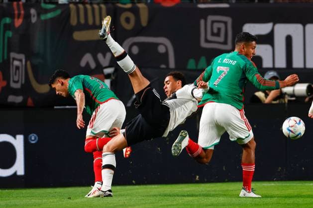 PHILADELPHIA, PA - OCTOBER 17: Jamal Musiala 14 of Germany is upended during the International Friendly, Länderspiel, Nationalmannschaft between Germany and Mexico at Lincoln Financial Field on October 17, 2023 in Philadelphia, Pennsylvania. (Photo by Rich Graessle Icon Sportswire) SOCCER: OCT 17 Mexico vs Germany EDITORIAL USE ONLY Icon23101825547