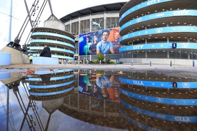Football - Premier League - Manchester City v Brighton & Hove Albion 21st October 2023 - Premier League - Manchester City v Brighton & Hove Albion - A general view (GV) of the Etihad Stadium reflected in a puddle - Photo: Simon Stacpoole Offside. Manchester UK Copyright: xSimonxStacpoolexOffside