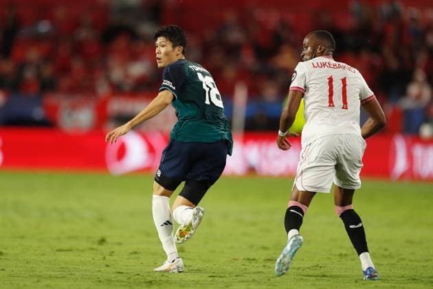 (L-R) Takehiro Tomiyasu (Arsenal), Dodi Lukebakio (Sevilla), OCTOBER 24, 2023 - Football Soccer : UEFA Champions League Group stage Group B match between Sevilla FC 1-2 Arsenal FC at the Estadio Ramon Sanchez-Pizjuan in Sevilla, Spain. Noxthirdxpartyxsales  (233543800)