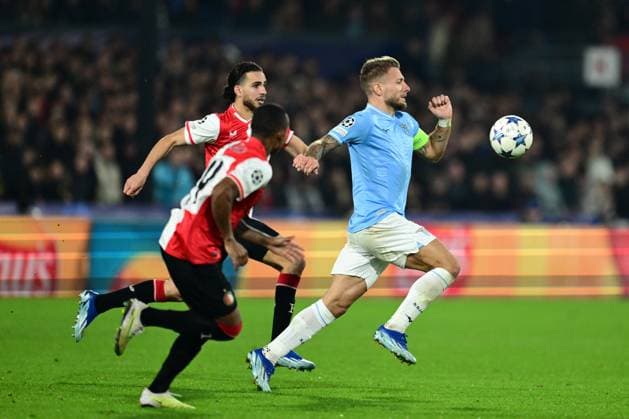 ROTTERDAM - (l-r) Ramiz Zerrouki of Feyenoord, Ciro Immobile of SS Lazio during the UEFA Champions League group E match between Feyenoord and Lazio Roma at Feyenoord Stadion de Kuip on October 25, 2023 in Rotterdam, Netherlands. ANP OLAF KRAAK UEFA Champions League 2023 24 2023 2024 xVIxANPxSportx xxANPxIVx 482106598 originalFilename: 482106598.jpg