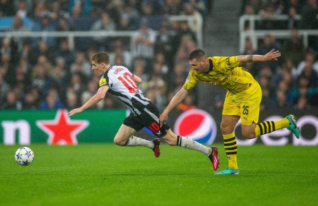 25th October 2023; St James Park, Newcastle, England; UEFA Champions League Football, Newcastle United versus Borussia Dortmund; Niklas Sule of Borussia Dortmund tackles Anthony Gordon of Newcastle United  ActionPlus12569093 VagelisxGeorgariou