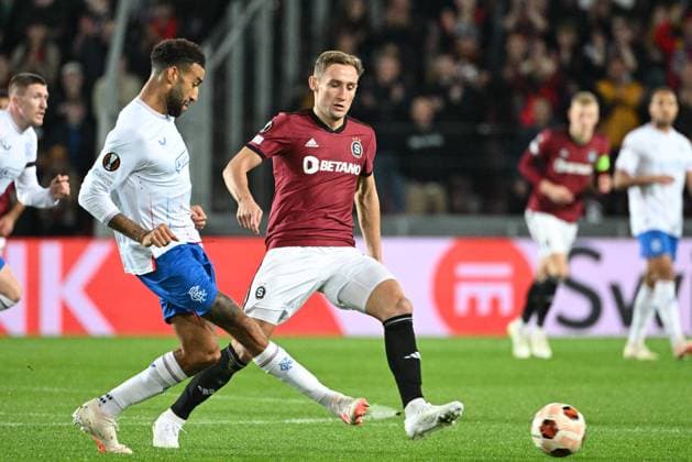From right Jan Kuchta of Sparta and Connor Goldson of Rangers in action during the Sparta Praha vs Glasgow Rangers, third round match of football European League, Group C in Prague, Czech Republic, October 26, 2023. (CTKxPhoto MichalxKamaryt) CTKPhotoP2023102608118  CTKPhotoP2023102608118