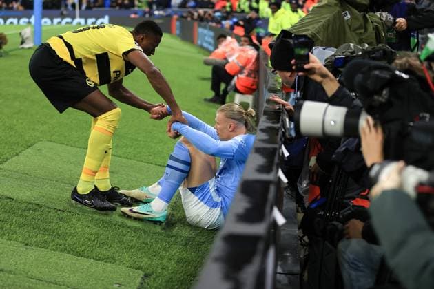 Football - UEFA Champions League - Group G - Manchester City v BSC Young Boys 7th November 2023 - UEFA Champions League - Group G - Manchester City v BSC Young Boys - Mohamed Ali Camara of Young Boys helps up Erling Haaland of Manchester City - Photo: Simon Stacpoole Offside. Manchester UK Copyright: xSimonxStacpoolexOffside