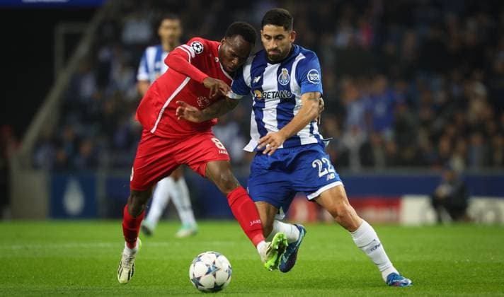 Antwerp s Alhassan Yusuf Abdullahi and Porto s Joao Mario fight for the ball during a game between Portuguese FC Porto and Belgian soccer team Royal Antwerp FC, on Tuesday 07 November 2023, in Porto, Portugal, on day four of the Champions League group stage, in the group H. VIRGINIExLEFOUR  x79482085x
