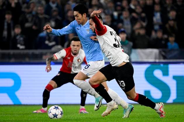 Daichi Kamada of SS Lazio and David Hancko of Feyenoord during the Champions League Group E football match between SS Lazio and Feyenoord at Olimpico stadium in Rome (Italy), November 7th, 2023. andreaxstaccioli