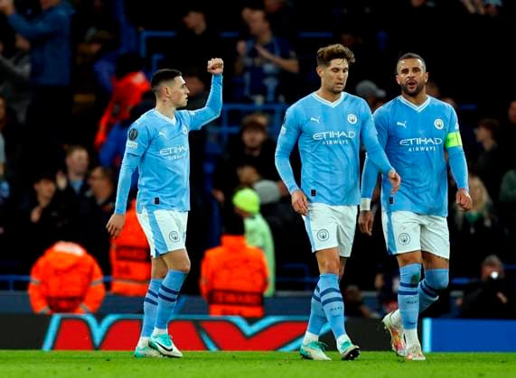 Football - 2023 2024 UEFA Champions League - Group G - Matchday Four of Six - Manchester City vs Young Boys - Etihad Stadium - Tuesday 7th November 2023 Manchester City players celebrate around Phil Foden after he scores just before half time to put City 2-0 ahead, at the Etihad. 