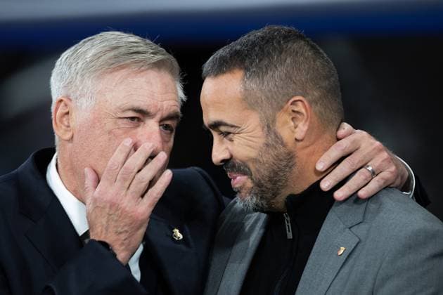 (231109) -- MADRID, Nov. 9, 2023 -- Real Madrid s head coach Carlo Ancelotti (L) talks with Braga s head coach Artur Jorge before the UEFA Champions League Group C match between Real Madrid and SC Braga in Madrid, Spain, Nov. 8, 2023. ) (SP)SPAIN-MADRID-FOOTBALL-UEFA CHAMPIONS LEAGUE-REAL MADRID VS SC BRAGA MengxDingbo 