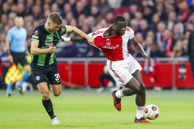 AMSTERDAM, 09-11-2023 JohanCruyff Arena, Europa League Football season 2023 2024. Ajax player Brian Brobbey and Brighton player Joel Veltman during the match between Ajax and Brighton & Hove Albion Ajax - Brighton  x23102496x Copyright: