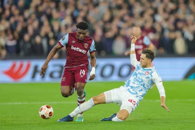 West Ham United v Olympiacos Europa League 09 11 2023. Olympiakos defender Panagiotis Retsos (45) performs a sliding tackle on West Ham United midfielder Mohammed Kudus (14) during the Europa League match between West Ham United and Olympiacos at the London Stadium, London, England on 9 November 2023. London London Stadium England Editorial use only , Copyright: xToyinxOshodix PSI-18363-0013
